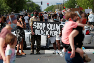 Protesters in Minneapolis gather at the scene May 27, 2020, where George Floyd, an unarmed black man, was pinned down by a police officer kneeling on his neck before later dying in hospital May 25. (CNS photo/Eric Miller, Reuters)